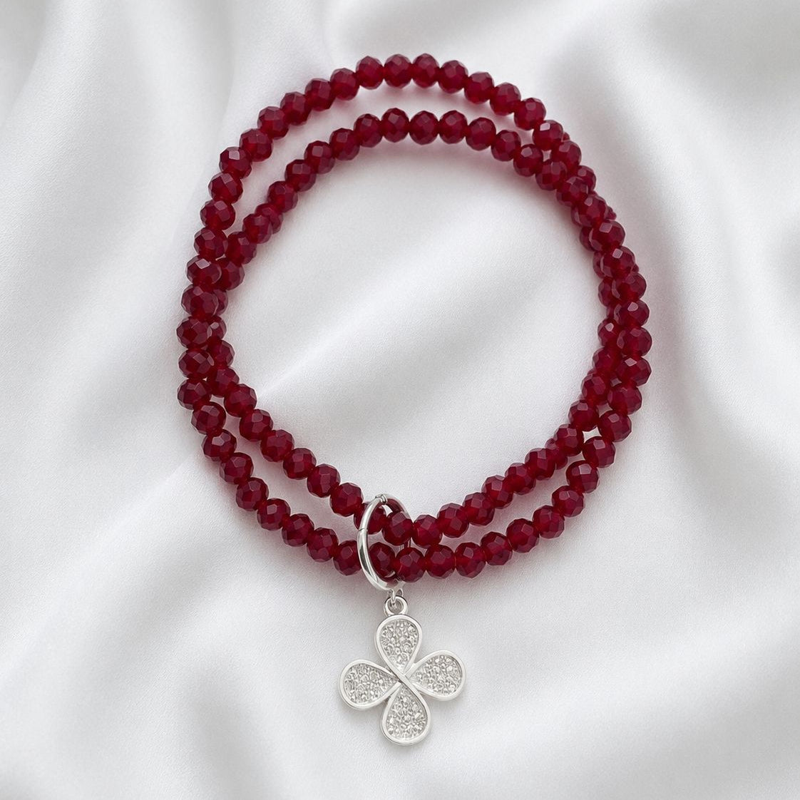 Pulsera elasticada - Cristal facetado rojo vino - Trébol con circón
